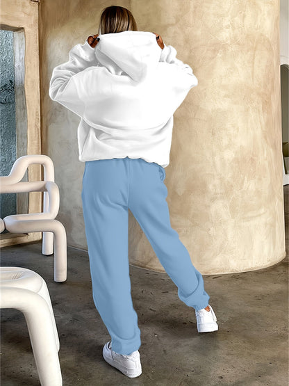 Ensemble survêtement femme blanc et violet motif géométrique