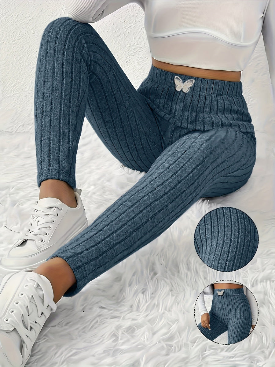 High-waisted light gray ribbed leggings with butterfly detail