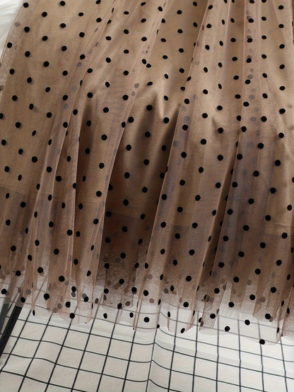 Gonna midi elegante a pois da donna, stile svasato chic, ideale per primavera ed estate