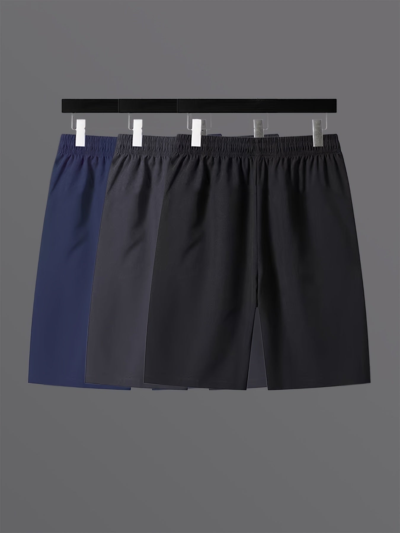 Short de sport décontracté pour homme avec poches zippées et motif géométrique