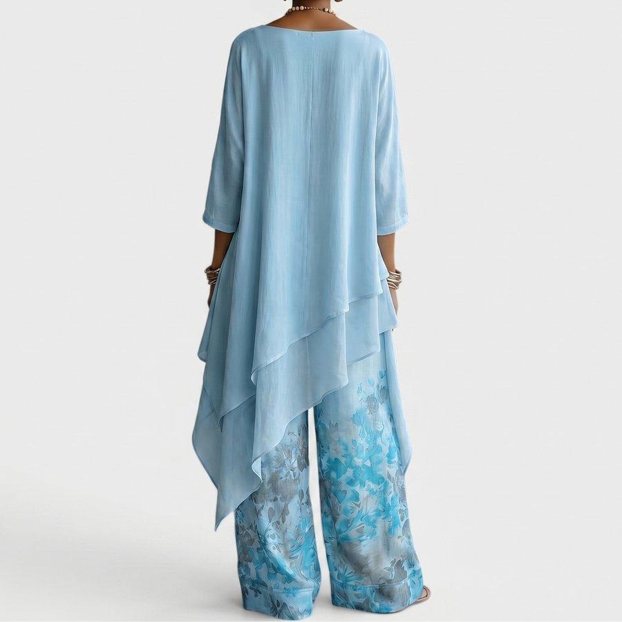 Sett med asymmetrisk bluse og ledig bukse med sennepsfarget trykk