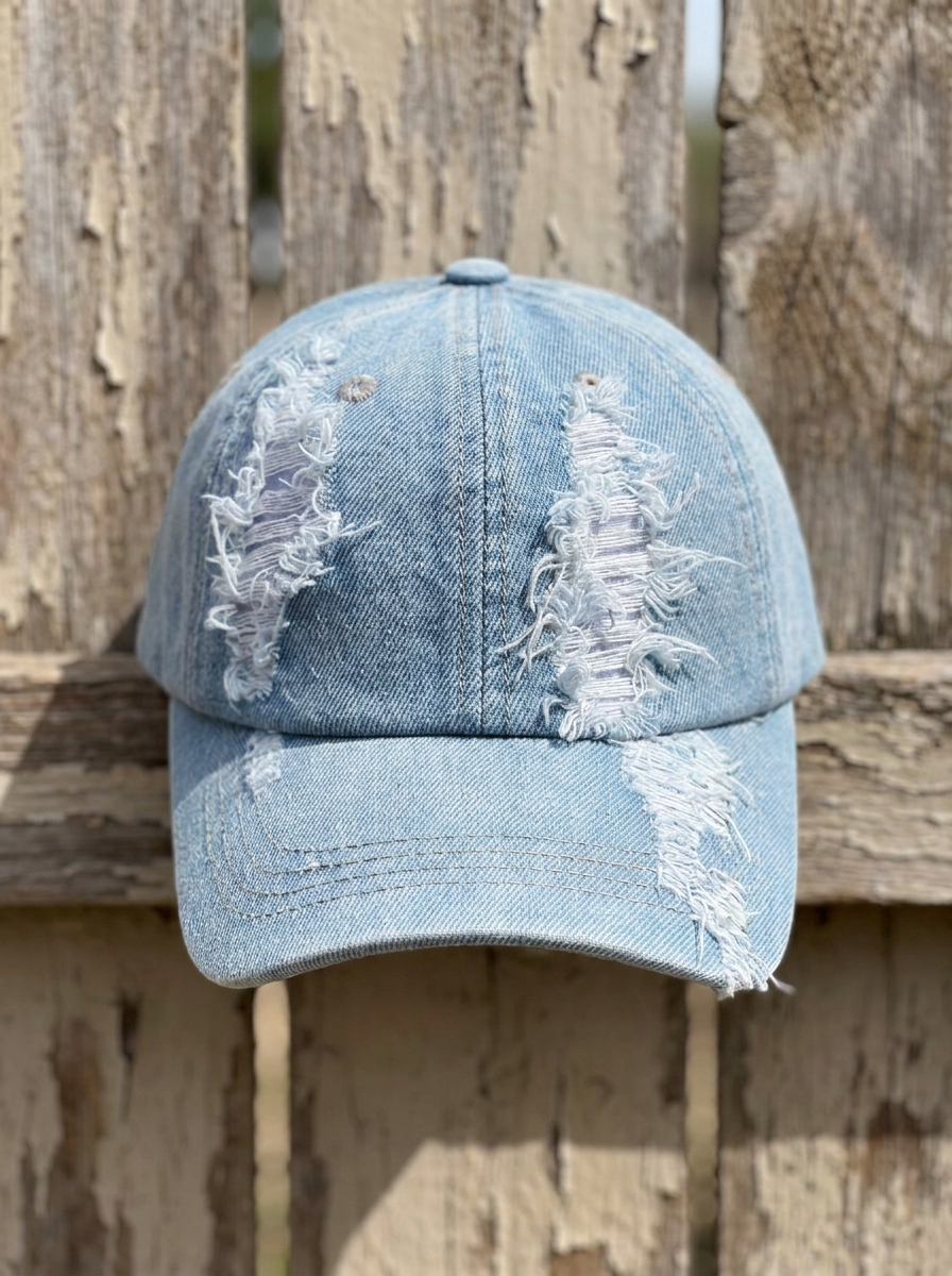 Distressed and ripped faded denim baseball cap