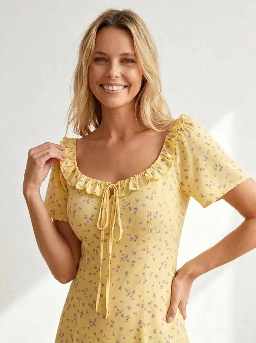 Long yellow dress with floral print and ruffled square neckline