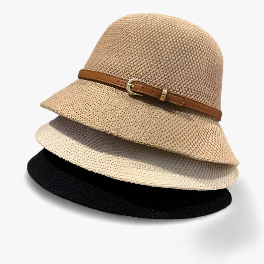 Cloche hat with decorative band and buckle