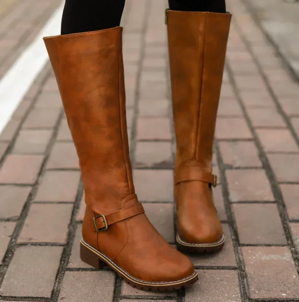 Women's tall riding boots with decorative buckles